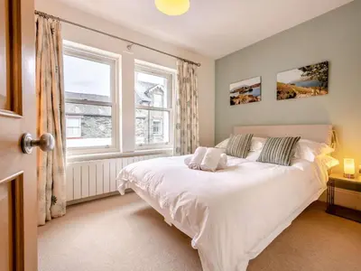 a bedroom with a white bed and a window at 2 Bed in Keswick oc-89257 in Keswick