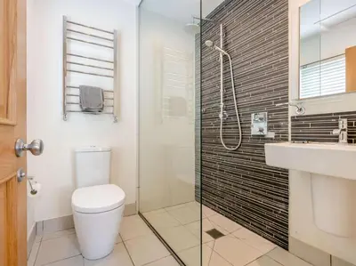a bathroom with a toilet and a shower and a sink at 2 Bed in Keswick oc-89257 in Keswick