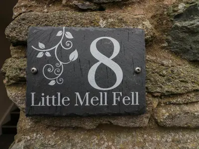 a sign on the side of a stone wall at 8 Little Mell Fell in Penrith