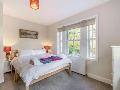 a bedroom with a bed and a large window at 2 Bed in Ayr 90039 in Ayr