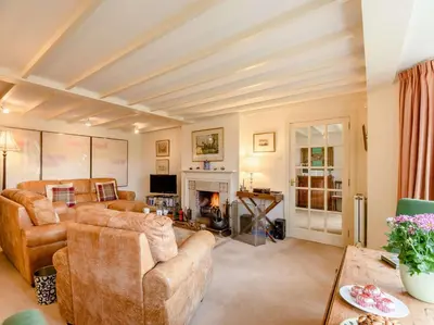 a living room with couches and a fireplace at 4 Bed in AYR 90038 in Ayr