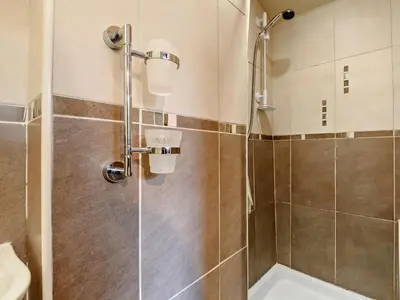 a shower with a glass door in a bathroom at 3 Bed in Egremont oc-90050 in Hale