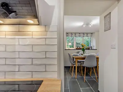 a kitchen and dining room with a table and chairs at 2 Bed in Keswick oc-90064 in Threlkeld
