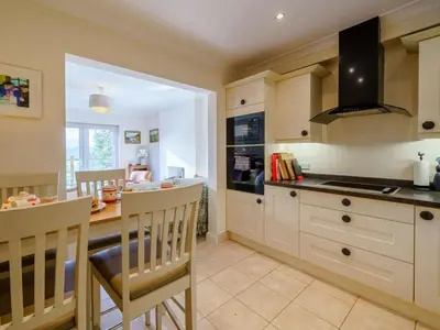a kitchen with a table and a dining room at 3 Bed in Keswick oc-90266 in Applethwaite