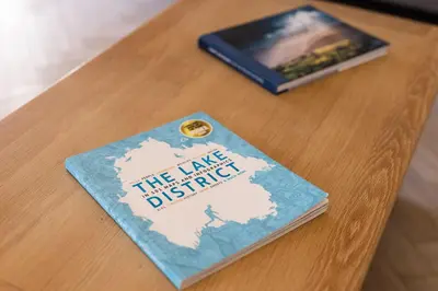 a book sitting on top of a table at Sheepfold Barn in Penruddock