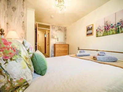 a bedroom with a bed with pillows at 2 Bed in Keswick oc-sz427 in Keswick