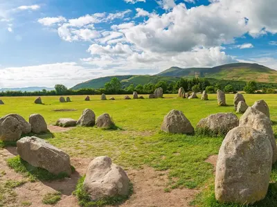 a field of rocks with mountains in the background at 2 Bed in Keswick oc-sz427 in Keswick