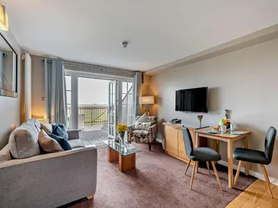 a living room with a couch and a table at 1 Bed in Ullswater 90300 in Penruddock