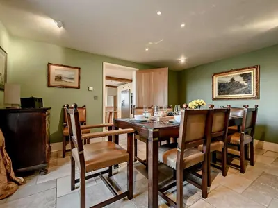 a dining room with a wooden table and chairs at 5 Bed in Cockermouth oc-91503 in Embleton
