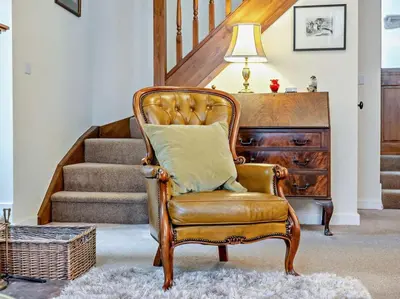 a chair with a pillow in a living room at 1 Bed in Penrith oc-91812 in Dockray