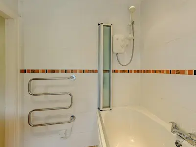 a bathroom with a shower and a bath tub at 1 Bed in Gilcrux 92218 in Gilcrux