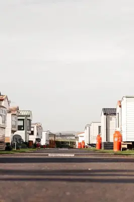 an empty street with houses on the side of the road at Bay 1 in Kirkcolm