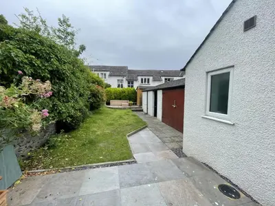 a backyard of a house with a driveway at Ellergill in Keswick