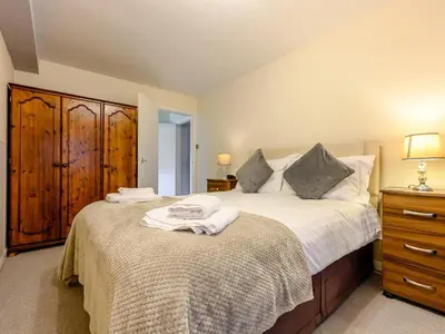 a bedroom with a bed with towels on it at 2 Bed in Keswick 28377 in Braithwaite