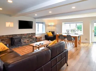 a living room with a couch and a fireplace at 2 Bed in Keswick 28377 in Braithwaite
