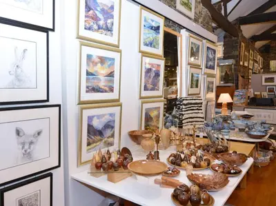 a room filled with lots of pictures on a wall at 1 Bed in Keswick oc-28382 in Braithwaite