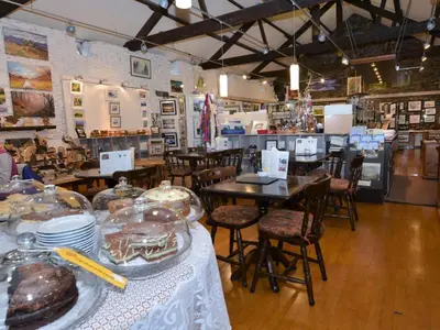 a bakery with tables and chairs and cakes on display at 1 Bed in Keswick oc-28382 in Braithwaite