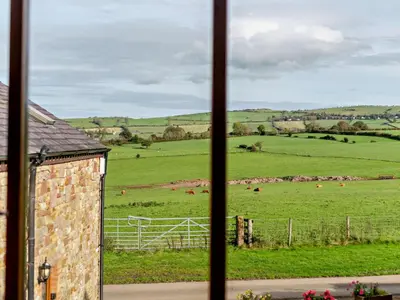 a view of a field from a window at 2 Bed in Bassenthwaite 93463 in Ireby