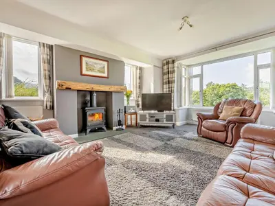 a living room with two couches and a fireplace at 3 Bed in Keswick 93202 in Keswick