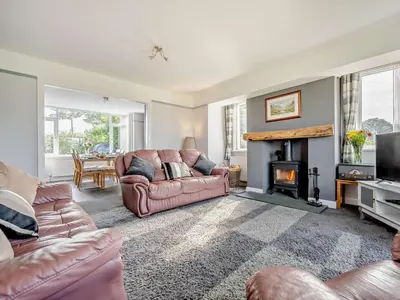 a living room with a couch and a fireplace at 3 Bed in Keswick 93202 in Keswick