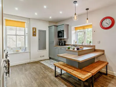 a kitchen with a sink and a bench in it at 1 Bed in Cockermouth oc-93147 in Cockermouth