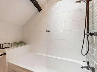 a bathroom with a shower and a bath tub at 2 Bed in Ambleside oc-sz500 in Grasmere