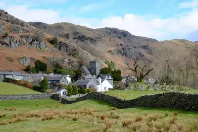a village in a field with mountains in the background at 3 Bed in Chapel Stile SZ161 in Chapel Stile
