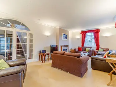 a large living room with couches and a tv at 4 Bed in Cockermouth oc-85979 in Buttermere