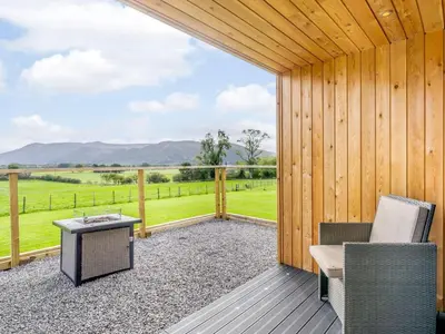 a screened in porch with a table and chairs at 1 Bed in Keswick oc-82476 in Bassenthwaite