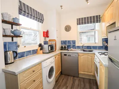 a kitchen with a washer and dryer at Walla Crag, Royal Oak House in Keswick