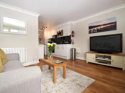 a living room with a couch and a tv at 1 Bed in Keswick SZ468 in Keswick