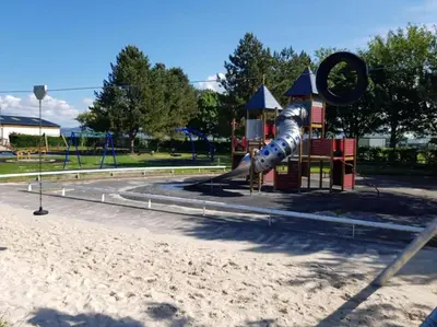 a playground in a park with a slide at HollyJess Hoose in Stranraer