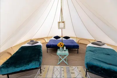 a room with two beds in a tent at Duke Travel Official TT Glamping - Douglas in Kirk Braddon