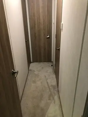 a small hallway with a door and a corridorngthngthngthngthngth at Lovely Caravan in Turnberry