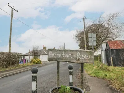 a street sign on the side of a road at Rosalin Cottage in Irvine