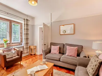 a living room with a couch and a chair at 2 Bed in Holmrook oc-sz403 in Santon Bridge
