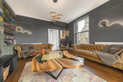 a living room with couches and a coffee table at The Eyrie in Keswick