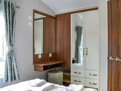 a bathroom with a sink and a mirror and a bed at Sea View 59 - Uk45586 in Mainsriddle