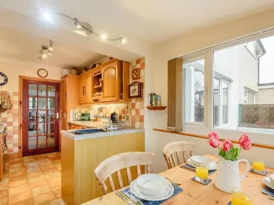 a kitchen and dining room with a table and chairs at 3 Bed in Portinscale 93949 in Portinscale