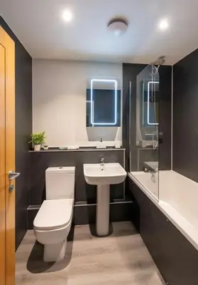 a bathroom with a toilet and a sink at *Penthouse Luxury Apartment 2min to City in Carlisle