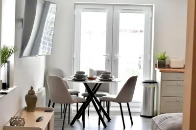 a dining room with a table and chairs at *Luxury Apartment 2min from City in Carlisle