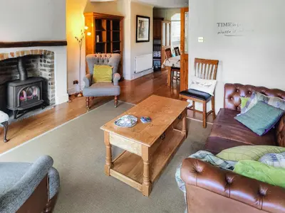 a living room filled with furniture and a fireplace at Little Hills in Keswick