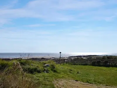 a view of a beach with the ocean in the background at Sandy Paws - Uk45511 in Mainsriddle
