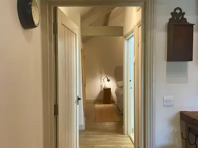 a hallway with a door leading to a bedroom at 1 Bed in Ullswater 94064 in Watermillock