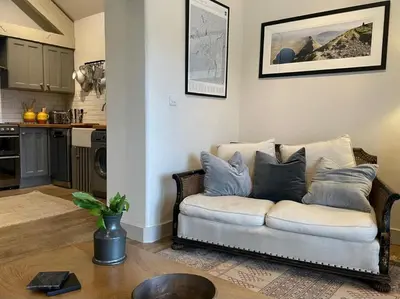 a living room with a couch with pillows on it at 1 Bed in Ullswater 94064 in Watermillock