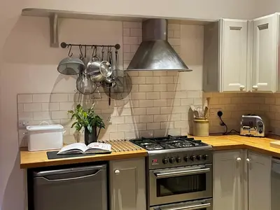 a kitchen with a stove and a book on the counter at 1 Bed in Watermillock 94065 in Watermillock