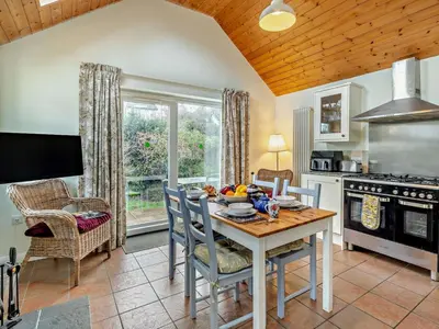 a kitchen with a table with a bowl of fruit on it at 1 Bed in Keswick oc-94245 in Keswick