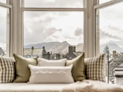 a couch in front of a window with a view at 6 Bed in Keswick 94361 in Keswick