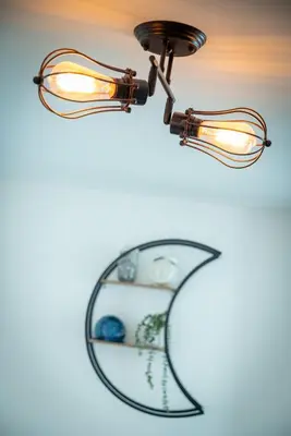a lamp hanging from a ceiling in a room at Kings Arms Suites - Deluxe Room - En-Suite - Self Check In in Whitehaven