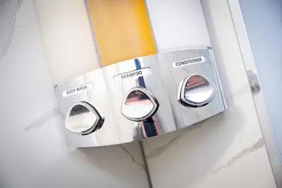 a close up of a toaster hanging on a wall at Kings Arms Suites - Luxury Double - Waterfall Shower - Self Check In in Whitehaven